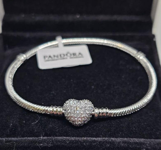 Pandora-style bracelet with heart-shaped rhinestone clasp.